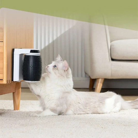 White cat using an automatic cat self groomer mounted on wooden furniture in a living room.