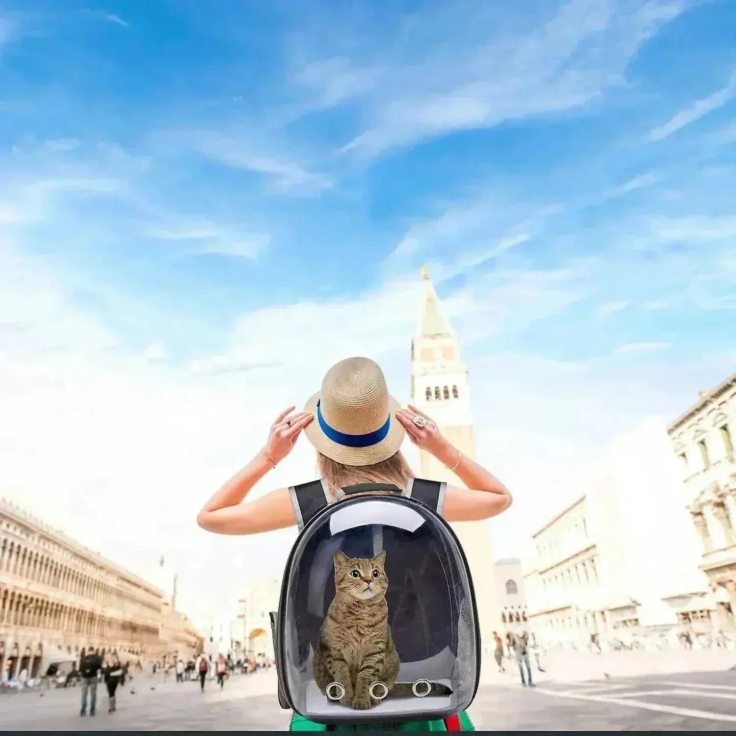 Woman wearing breathable pet carrier backpack with cat inside in a city outdoor setting